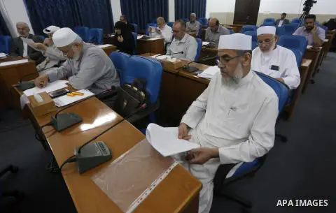 Members of the Palestinian legislative council from Hamas movement attend a meeting at the legislative council in Gaza city on June 8, 2016. Photo by Mohammed Asad