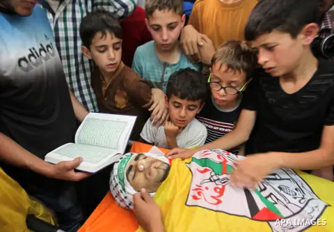 Relatives of Palestinian Jamal Dwikat, who died from wounds he sustained after he was shot during clashes with the Israeli army on Friday, mourn during his funeral in the West Bank village of Balata Albalad near Nablus J...