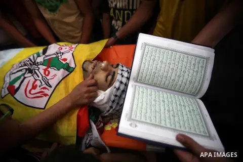 Relatives of Palestinian Jamal Dwikat, who died from wounds he sustained after he was shot during clashes with the Israeli army on Friday, mourn during his funeral in the West Bank village of Balata Albalad near Nablus J...