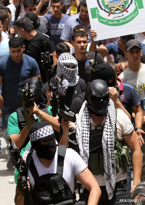 Mourners carry the body of Palestinian Jamal Dwikat, who died from wounds he sustained after he was shot during clashes with the Israeli army on Friday, during his funeral in the West Bank village of Balata Albalad near...