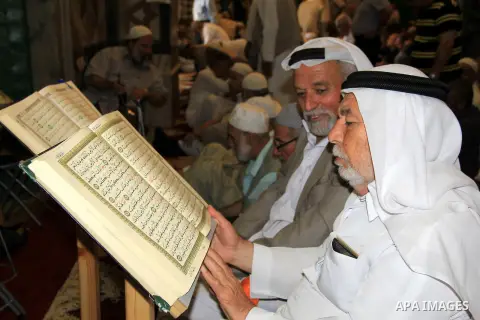 Palestinian men read holy Koran, Islam's holy book, at al-Aqsa mosque, in Jerusalem's old city on June 8, 2016. Ramadan is sacred to Muslims because it is during that month that tradition says the Koran was revealed to t...