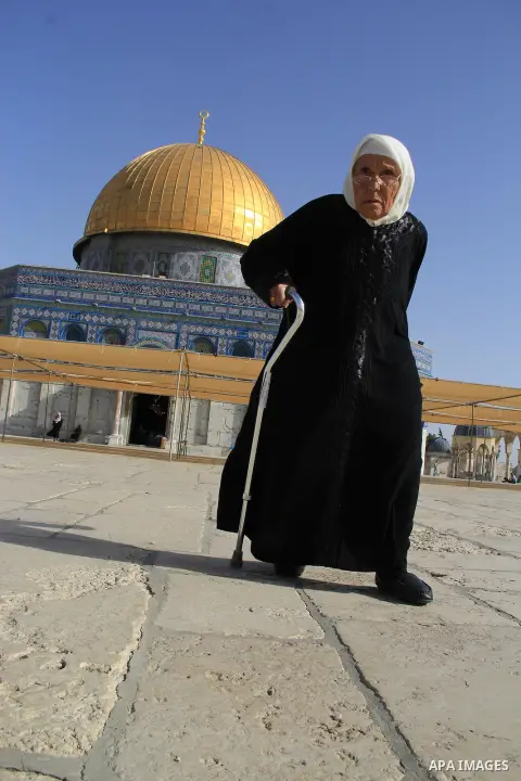 Palestinians Muslims walk walk in front of the Dome of the Rock mosque, in Jerusalem's old city on June 8, 2016. Ramadan is sacred to Muslims because it is during that month that tradition says the Koran was revealed to...