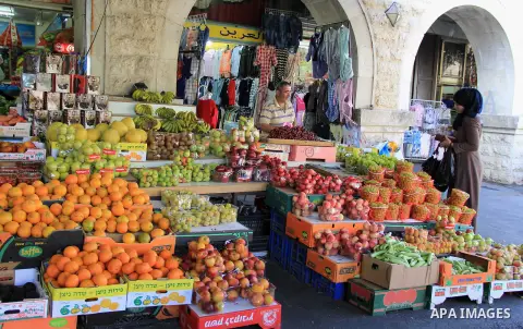 Palestinians shop at the Al-Aqsa Mosque, in Jerusalem, on June 9, 2016. Photo by Mahfouz Abu Turk