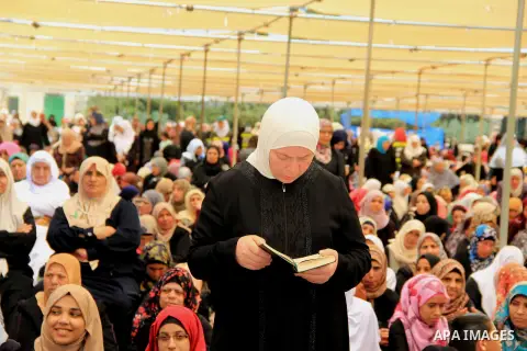 Palestinians pray in front of the Dome of the Rock at Jerusalem's Al-Asqa mosque compound during the first Friday prayers of the holy Muslim fasting month of Ramadan on June 10, 2016. Praying at the site, the third-holie...