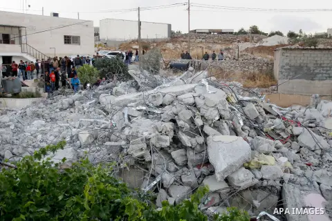Palestinians look at the rubble of Palestinian teenager Murad Idais house who was accused of stabbing to death a 38-year old Israeli nurse in an attack in the Israeli Otniel settlement in January 2016 after it was demoli...