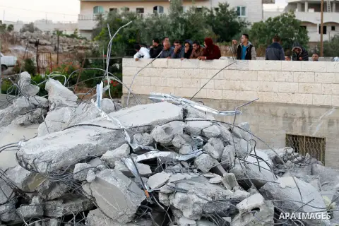 Palestinians look at the rubble of Palestinian teenager Murad Idais house who was accused of stabbing to death a 38-year old Israeli nurse in an attack in the Israeli Otniel settlement in January 2016 after it was demoli...