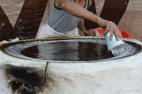 An Egyptian man prepares a traditional sweets "Konafa" on the holy month of Ramadan, in Cairo, Egypt, on June 12, 2016. Ramadan is sacred to Muslims because it is during that month that tradition says the Koran was revea...