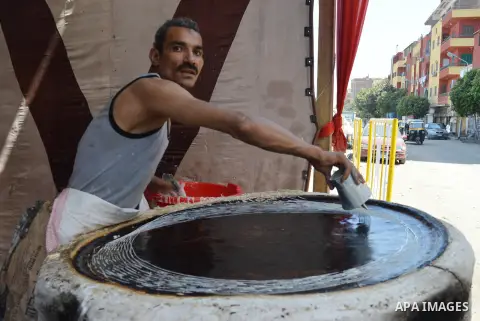 An Egyptian man prepares a traditional sweets "Konafa" on the holy month of Ramadan, in Cairo, Egypt, on June 12, 2016. Ramadan is sacred to Muslims because it is during that month that tradition says the Koran was revea...