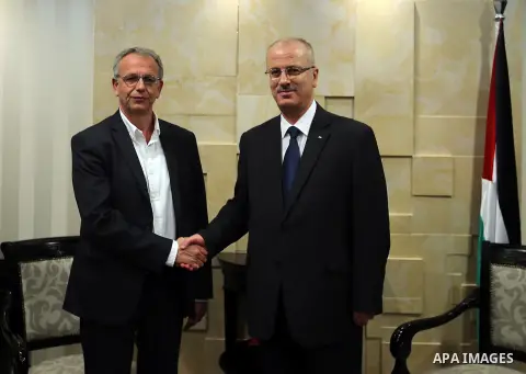 Palestinian Prime Minister Rami Hamdallah meets with a delegation from the Greek Syriza party, in the West Bank city of Ramallah on June 12, 2016. Photo by Prime Minister Office