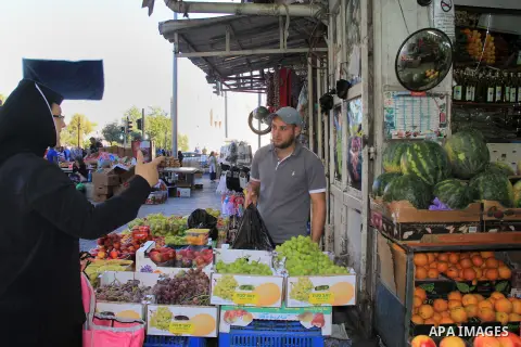 A Palestinian man sells fruits at a market during the Muslim holy fasting month of Ramadan in Jerusalem's old city on June, 12, 2016. Ramadan is sacred to Muslims because it is during that month that tradition says the K...
