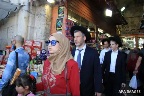 Palestinians shop at a market during the Muslim holy fasting month of Ramadan in Jerusalem's old city on June, 12, 2016. Ramadan is sacred to Muslims because it is during that month that tradition says the Koran was reve...
