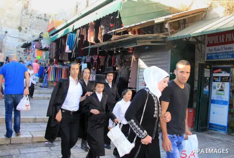 Palestinians shop at a market during the Muslim holy fasting month of Ramadan in Jerusalem's old city on June, 12, 2016. Ramadan is sacred to Muslims because it is during that month that tradition says the Koran was reve...