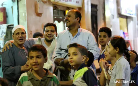 An Egyptian dawn awakener "al-Musaharati" ride a donkey through streets to wake up Muslims for a meal before sunrise during the fasting month of Ramadan, in Cairo, Egypt, on June 13, 2016. Al-Musaharati is an old profess...