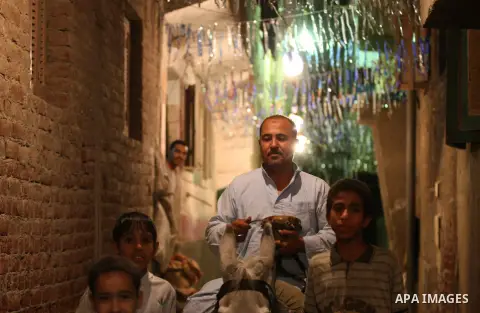 An Egyptian dawn awakener "al-Musaharati" ride a donkey through streets to wake up Muslims for a meal before sunrise during the fasting month of Ramadan, in Cairo, Egypt, on June 13, 2016. Al-Musaharati is an old profess...