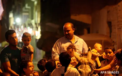 An Egyptian dawn awakener "al-Musaharati" ride a donkey through streets to wake up Muslims for a meal before sunrise during the fasting month of Ramadan, in Cairo, Egypt, on June 13, 2016. Al-Musaharati is an old profess...