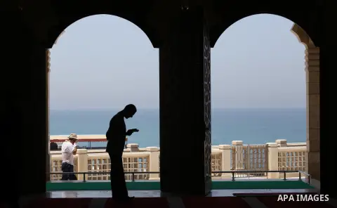 A Palestinian man sits reading the Koran, Islam's holy book, at the al-Khaldi mosque during the Muslim fasting month of Ramadan, in Gaza City on June 13, 2016. Photo by Mohammed Asad