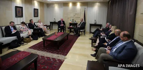 Palestinian Prime Minister, Rami Hamdallah, meets with Ireland's Foreign Minister, in the West Bank city of Ramallah, on June 14, 2016. Photo by Prime Minister Office