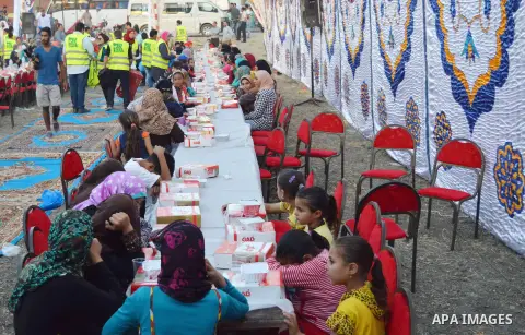 Egyptian Muslims eat their Iftar meal as they break their fast during the holy fasting month of Ramadan, in Alexandria, Egypt, on June 14, 2016. Ramadan is sacred to Muslims because it is during that month that tradition...