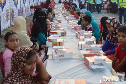 Egyptian Muslims eat their Iftar meal as they break their fast during the holy fasting month of Ramadan, in Alexandria, Egypt, on June 14, 2016. Ramadan is sacred to Muslims because it is during that month that tradition...