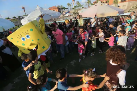 Palestinian children play as they wait to break their daytime fast, during the Muslim holy month of Ramadan, in Gaza city on June 15, 2016. Ramadan is sacred to Muslims because it is during that month that tradition says...