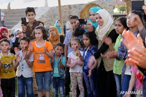 Palestinian children play as they wait to break their daytime fast, during the Muslim holy month of Ramadan, in Gaza city on June 15, 2016. Ramadan is sacred to Muslims because it is during that month that tradition says...