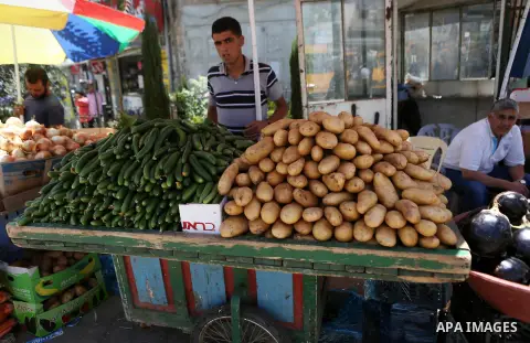 A Palestinian vendor sells fruits at a market on the holy month of Ramadan in the West bank city of Ramallah, on June 16, 2016. Ramadan is sacred to Muslims because it is during that month that tradition says the Koran w...