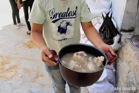 Palestinian cooks prepare a charity meal before the breakfast in the Islamic holy month of Ramadan, in Jerusalem, on June 16, 2016. Muslims around the world celebrate Ramadan, the holy month in the Islamic calendar, in w...