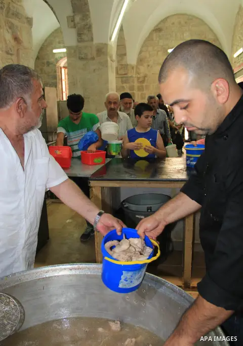 Palestinian cooks prepare a charity meal before the breakfast in the Islamic holy month of Ramadan, in Jerusalem, on June 16, 2016. Muslims around the world celebrate Ramadan, the holy month in the Islamic calendar, in w...