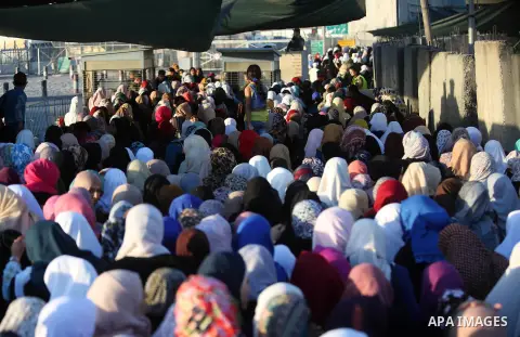 Palestinian women wait to cross the Qalandia checkpoint between the West Bank city of Ramallah and Jerusalem on June 17, 2016, as they head to Jerusalem's Al-Aqsa mosque for the second Friday prayer of the holy Muslim fa...