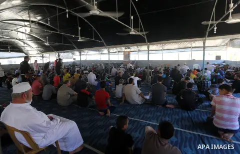 Palestinian Muslim worshippers perform the second Friday prayers of the holy Muslim fasting month of Ramadan at a mosque which was destroyed during the 50-day war between Israel and Hamas militants in the summer of 2014,...