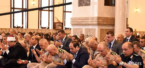 Egyptian President Abdel Fattah al-Sisi performs Friday prayers at Al-Tantawi mosque, to mark the anniversary of the Tenth of Ramadan, in Cairo, Egypt, on June 17, 2016. Photo by Egyptian President Office