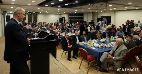 Palestinian Prime Minister, Rami Hamdallah, Participate in the central collective breakfast for the families of martyrs during the fasting month of Ramadan, in the West bank city of Ramallah, on June 17, 2016. Ramadan is...