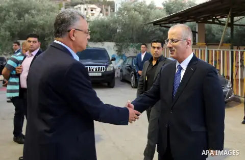 Palestinian Prime Minister Rami Hamdallah takes part during take breakfast for orphans on holy fasting month of Ramadan, in the West Bank city of Tulkarem, on June 18, 2016. Photo by Prime Minister Office