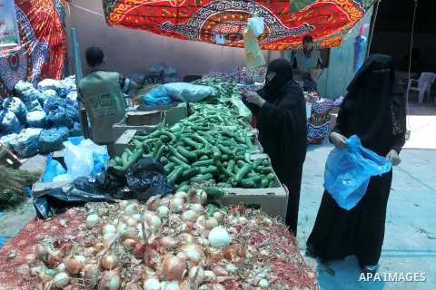 Palestinians shop at the Ramadan Charity market for poor families, Funded by "Gift of the Givers" South Africa, in Khan Younis in the southern Gaza strip, on June 20, 2016. Photo by Abed Rahim Khatib