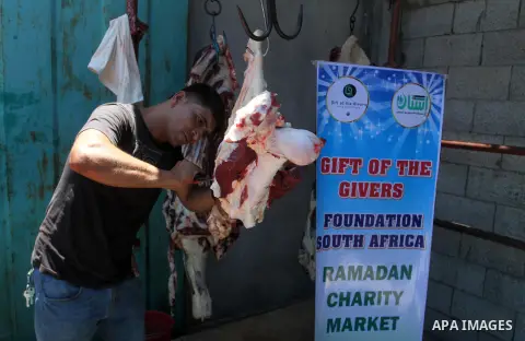 Palestinians shop at the Ramadan Charity market for poor families, Funded by "Gift of the Givers" South Africa, in Khan Younis in the southern Gaza strip, on June 20, 2016. Photo by Abed Rahim Khatib