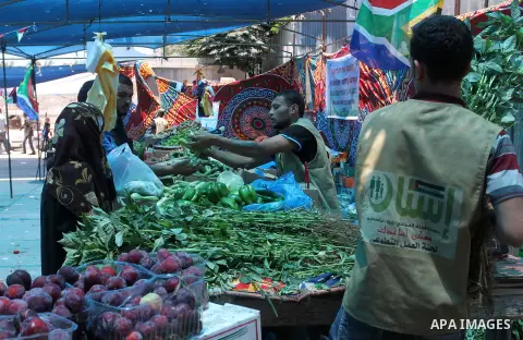 Palestinians shop at the Ramadan Charity market for poor families, Funded by "Gift of the Givers" South Africa, in Khan Younis in the southern Gaza strip, on June 20, 2016. Photo by Abed Rahim Khatib