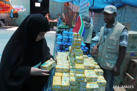 Palestinians shop at the Ramadan Charity market for poor families, Funded by "Gift of the Givers" South Africa, in Khan Younis in the southern Gaza strip, on June 20, 2016. Photo by Abed Rahim Khatib