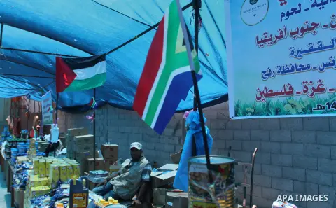 Palestinians shop at the Ramadan Charity market for poor families, Funded by "Gift of the Givers" South Africa, in Khan Younis in the southern Gaza strip, on June 20, 2016. Photo by Abed Rahim Khatib