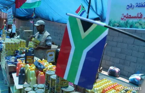 Palestinians shop at the Ramadan Charity market for poor families, Funded by "Gift of the Givers" South Africa, in Khan Younis in the southern Gaza strip, on June 20, 2016. Photo by Abed Rahim Khatib