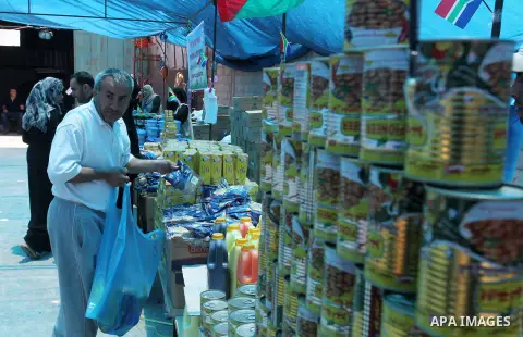 Palestinians shop at the Ramadan Charity market for poor families, Funded by "Gift of the Givers" South Africa, in Khan Younis in the southern Gaza strip, on June 20, 2016. Photo by Abed Rahim Khatib