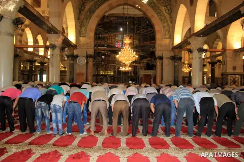 Palestinian Muslim worshippers perform the afternoon (Asr) prayer during the holy fasting month of Ramadan at al-Aqsa mosque, in Jerusalem's old city on June 20, 2016. Ramadan is sacred to Muslims because it is during th...