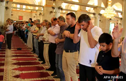Palestinian Muslim worshippers perform the afternoon (Asr) prayer during the holy fasting month of Ramadan at al-Aqsa mosque, in Jerusalem's old city on June 20, 2016. Ramadan is sacred to Muslims because it is during th...