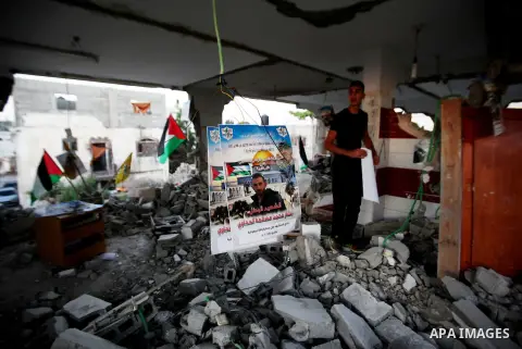 A Palestinian boy inspects the home of the Bashar Masalha that was demolished by the Israeli military in the West bank city of Qalqilya, on June 21, 2016. Bashar Masalha was killed in Jaffa city on 8 March 2016, under th...