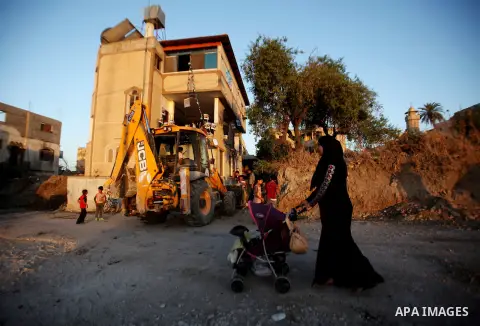 Palestinians inspect the home of the Bashar Masalha that was demolished by the Israeli military in the West bank city of Qalqilya, on June 21, 2016. Bashar Masalha was killed in Jaffa city on 8 March 2016, under the pret...