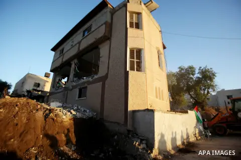 Palestinians inspect the home of the Bashar Masalha that was demolished by the Israeli military in the West bank city of Qalqilya, on June 21, 2016. Bashar Masalha was killed in Jaffa city on 8 March 2016, under the pret...