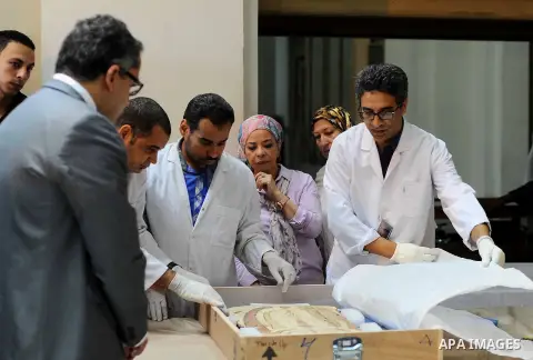 Egyptian antiquities officials carry a lid of a sarcophagus on its arrival to the Egyptian Museum in Cairo, Egypt, on June 21, 2016. Two ancient Egyptian sarcophagus covers have been delivered to Cairo's Egyptian Museum...