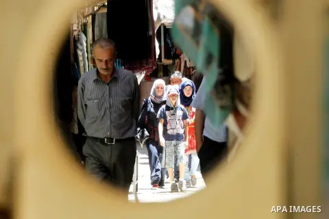 Palestinians shop at market on the holy month of Ramadan at market in the Old City of the West Bank town of Hebron on June 22, 2016. Ramadan is sacred to Muslims because it is during that month that tradition says the Ko...