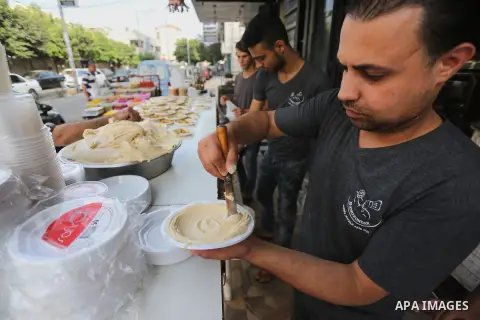 Palestinians prepare chickpeas known as hummus for breakfasting during the holy fasting month of Ramadan in Gaza city, on June 23, 2016. Muslims around the world refrain from eating, drinking and sexual intercourse from...
