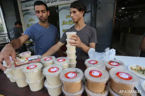 Palestinians prepare chickpeas known as hummus for breakfasting during the holy fasting month of Ramadan in Gaza city, on June 23, 2016. Muslims around the world refrain from eating, drinking and sexual intercourse from...