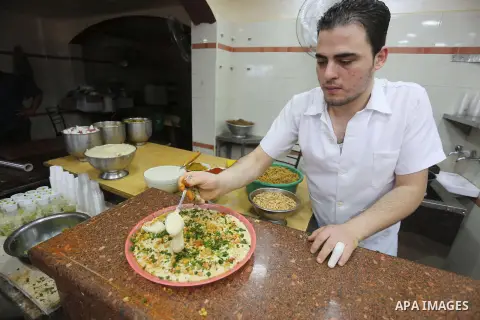 Palestinians prepare chickpeas known as hummus for breakfasting during the holy fasting month of Ramadan in Gaza city, on June 23, 2016. Muslims around the world refrain from eating, drinking and sexual intercourse from...